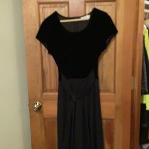 Size 8 black jumpsuit in stretch velvet and crepe legs and sash.